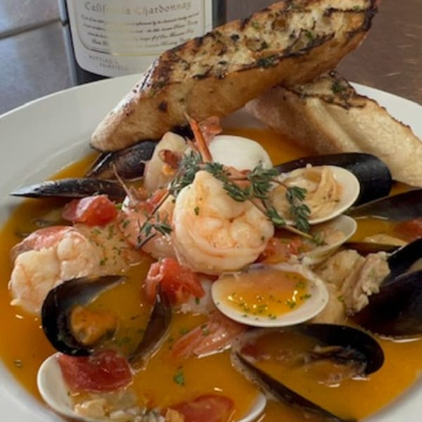 Martiniz Fresko Kitchen's seafood cioppino with shrimp, mussels, clams, and grilled bread.